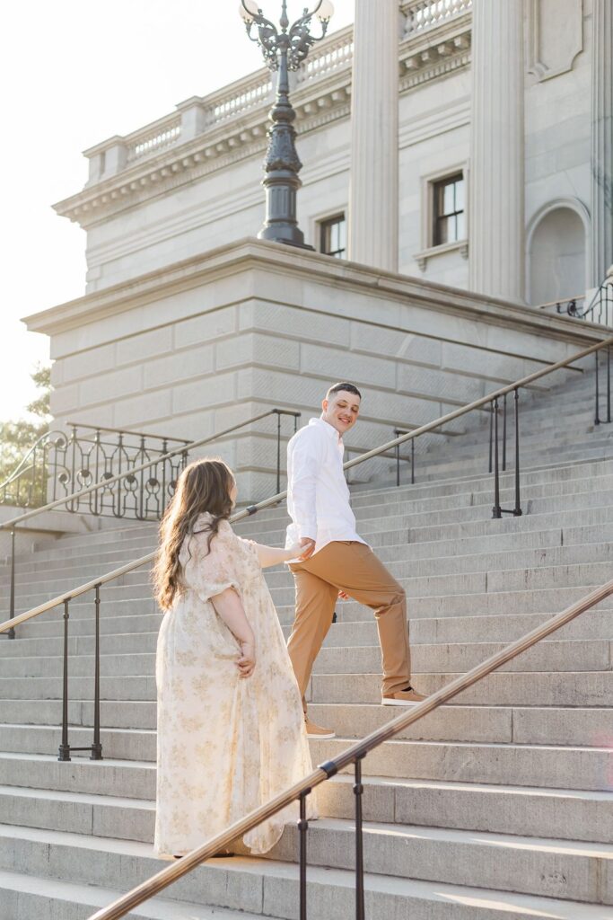 Couple walking up steps of State House in Columbia, SC
